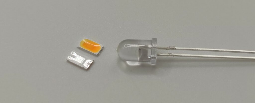 Comparison between old 5mm LED and newer SMD LED with thermal pad and better heat dissipation